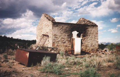 the wooden roof, windows, and door are gone